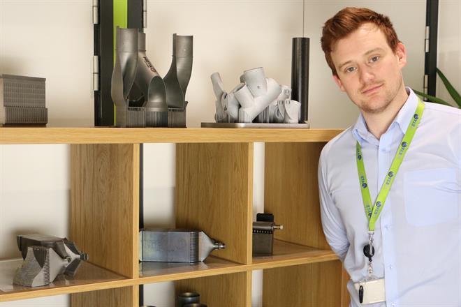 Stephen Mellor pictured with a range of complex additively manufactured components
